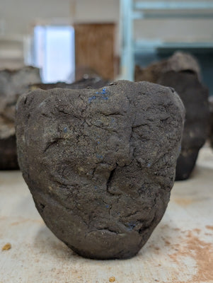 Handbuilt Black Clay Vessel – Sculptural Form with Blue Glaze Inclusions: Ceramic Piece 1751