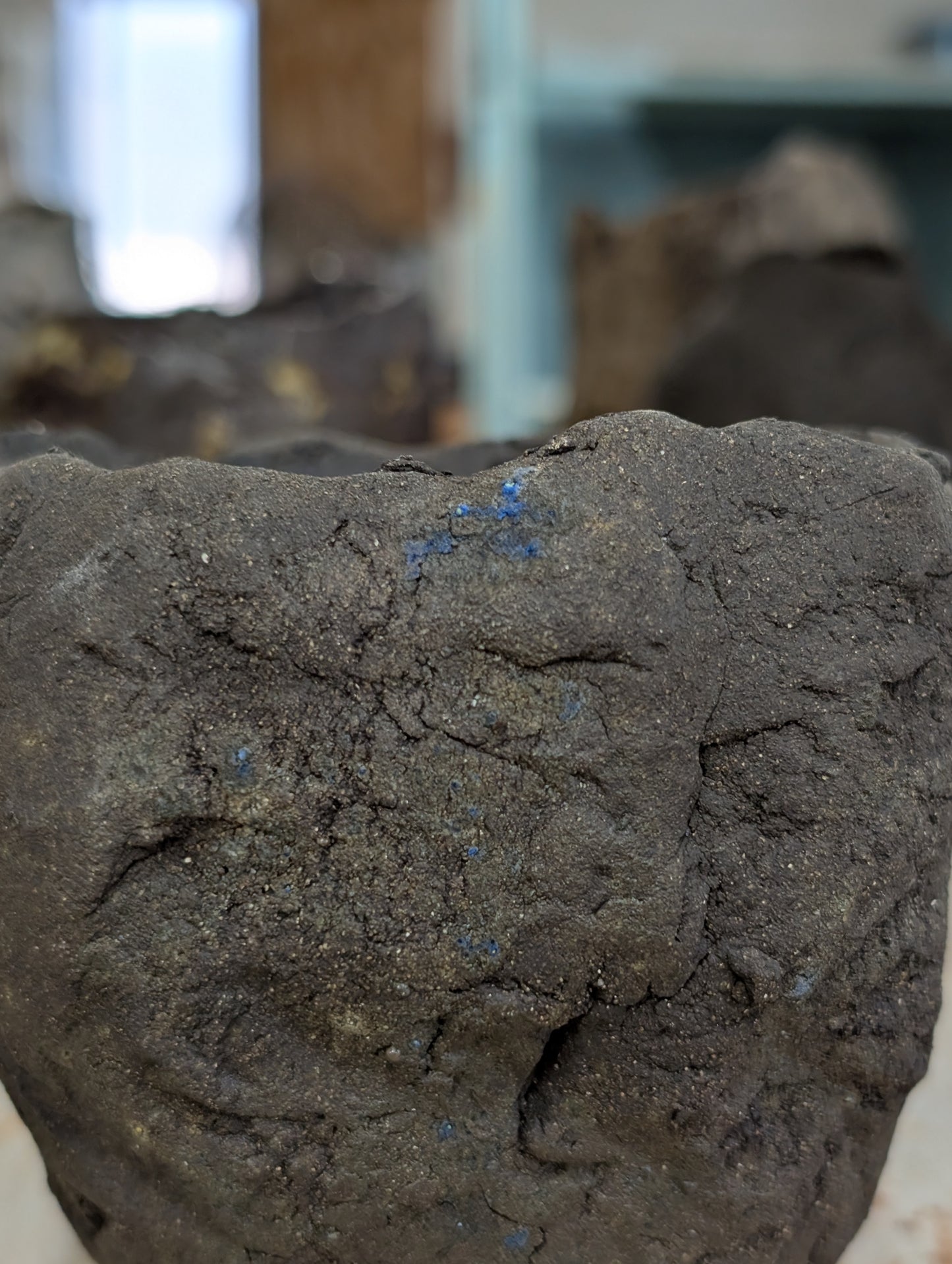 Handbuilt Black Clay Vessel – Sculptural Form with Blue Glaze Inclusions: Ceramic Piece 1751