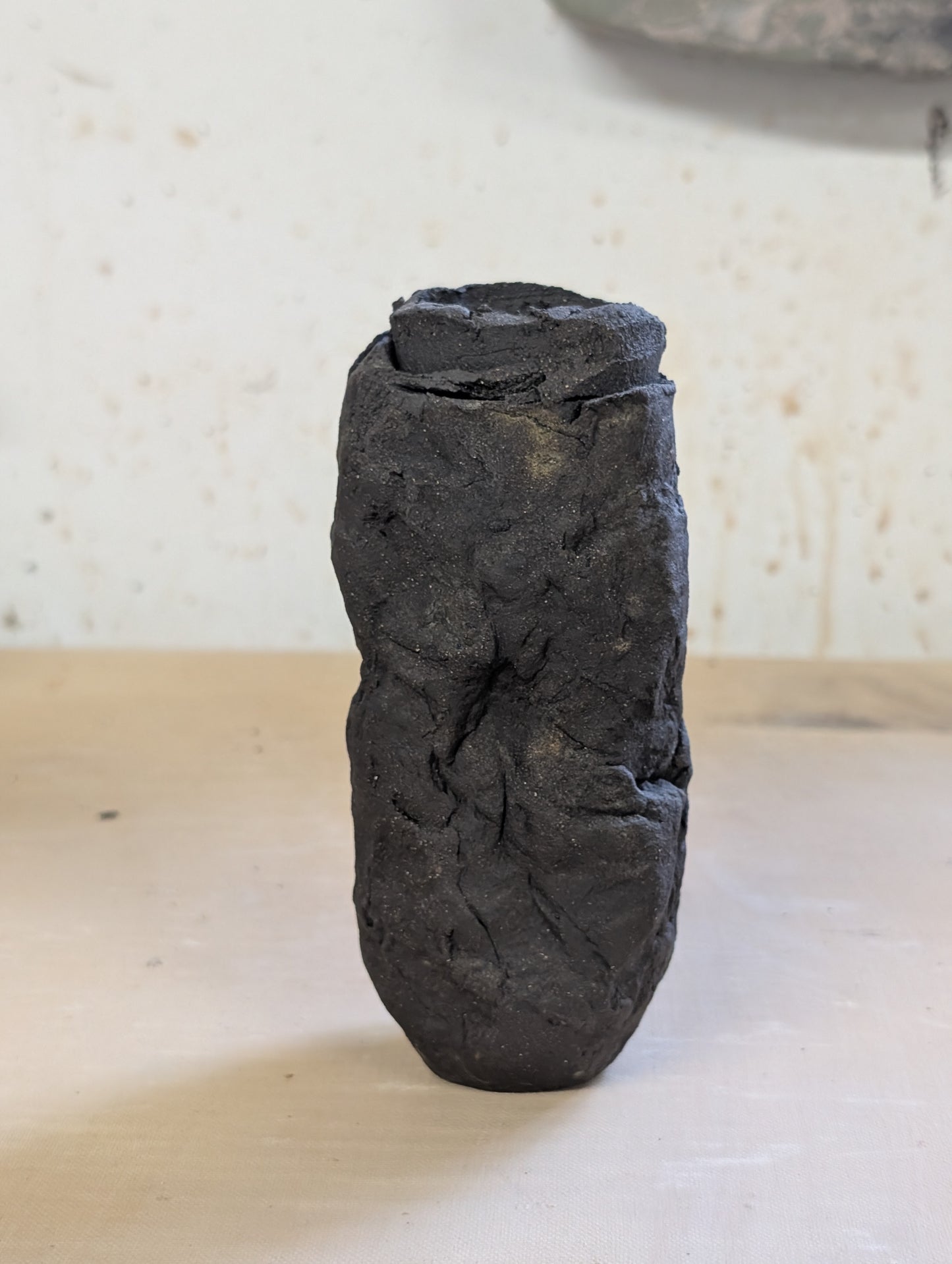 Ceramic Piece 1749: Handbuilt Black Clay Vase – Raw Sculptural Form with Organic Wrinkled Surface